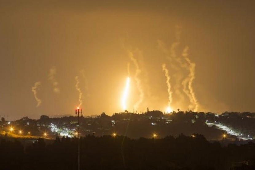 The Israeli community of Netiv Haasara is seen in front of flares fired by the Israeli army in Gaza July 23, 2014. 