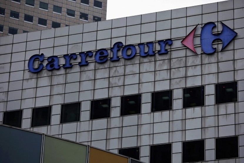 The sign and logo of Carrefour is pictured on a building. The logo will change into Trans Carrefour then completely remove the brand Carrefour after CT Corp acquires full ownership of the French-based retailer. (illustration)  