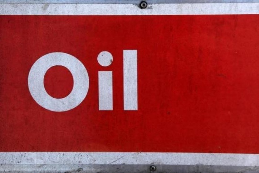 The word oil is pictured on an oil bank at a recycling yard in London March 2, 2011.