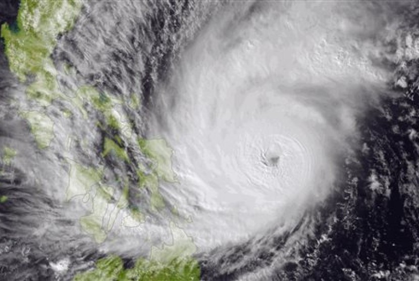 This image made available by the National Oceanic and Atmospheric Administration (NOAA) shows Typhoon Hagupit on Friday, Dec. 5, 2014, as it approaches the Philippines. 