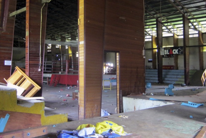This photo shows the interior of a stadium where more than a dozen of people were killed in a stampede after spectators rioted to protest a local boxer's loss, in Nabire, Papua province, Indonesia, Monday, July 15, 2013. 
