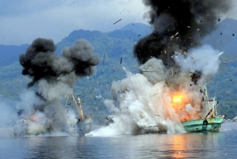 Two foreign vessels Century 4 and Century 7, explode during the sinking process by Indonesian Navy in Ambon Gulf on Sunday, December 21, 2014. 