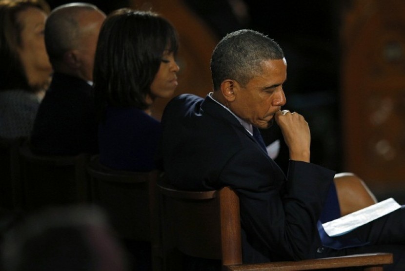 US President Barack Obama and his wife Michelle attend an inter-faith memorial service for the victims of the bombing at the Boston Marathon in Boston, Massachusetts April 18, 2013. 