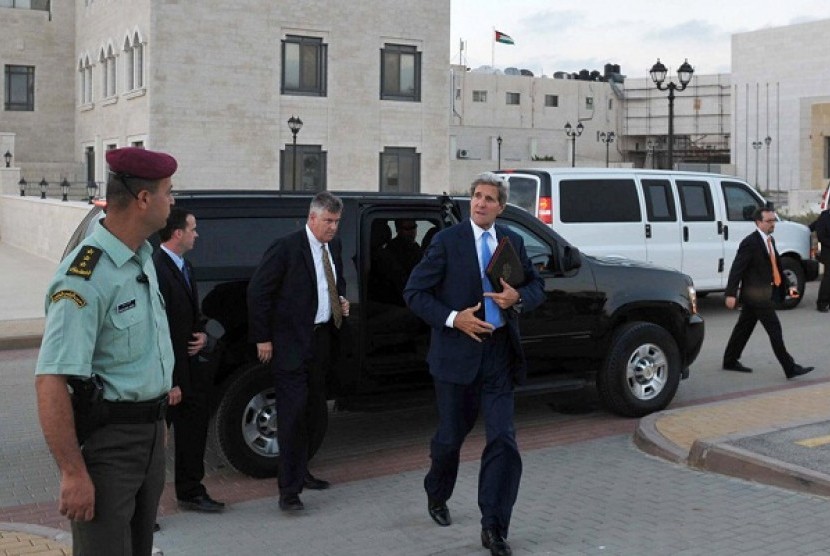US Secreatry of State John F Kerry steps out of a vehicle as he prepares to depart from a meeting with Palestinian President Mahmoud Abbas on Friday in Ramallah, West Bank. 
