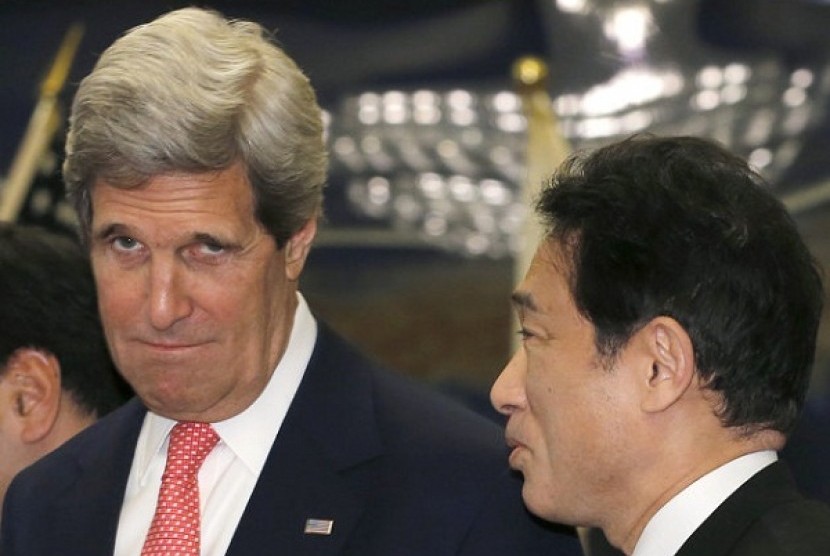 US Secretary of Sate John Kerry, left, is greeted by Japanese Foreign Minister Fumio Kishida prior to their meeting at Foreign Ministry's Iikura Guesthouse in Tokyo Sunday, April 14, 2013.