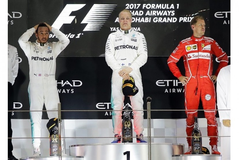 Valtteri Bottas (tengah) menjuarai GP F1 Abu Dhabi di Yas Marina, Ahad (26/11).
