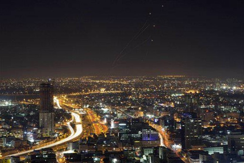 View of central Israel seen from Tel Aviv as an Iron Dome air defense system fires to intercept a rocket from the Gaza Strip, Israel, Thursday, July 10, 2014.