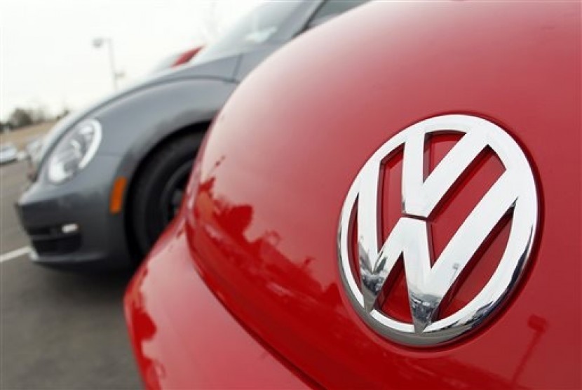 Volkswagen logo shows on the hood of a 2012 Beetle at a Volkswagen dealership in the south Denver suburb of Littleton, Colo. 