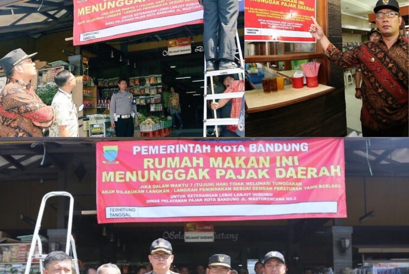 Wali Kota Bandung, Ridwan Kamil memasang spanduk peringatan terhadap sebuah rumah makan di Kota Bandung karena tidak membayar pajak, Kamis (29/9).