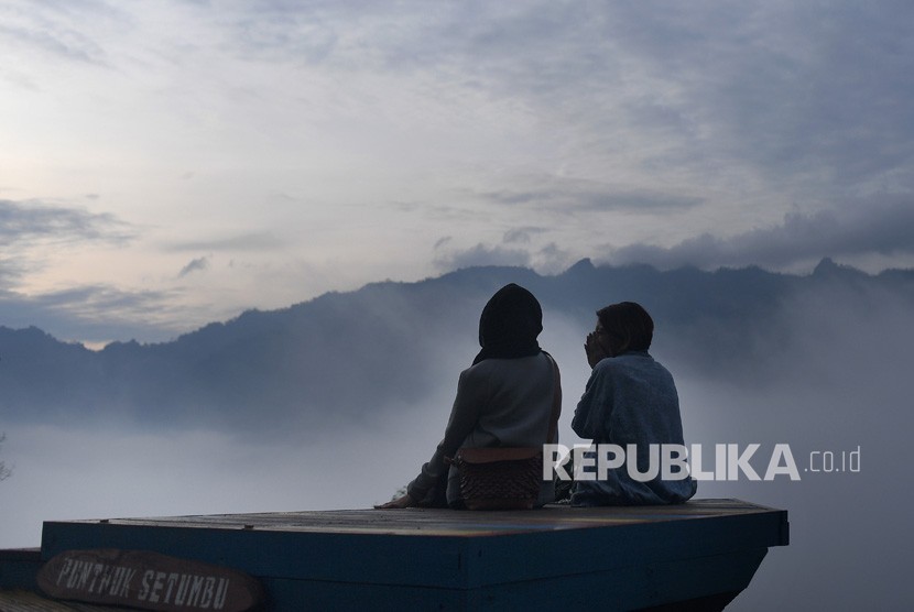 Tourists enjoying view at of Punthuk Setumbu, Borobudur, Magelang, Central Java in the morning.