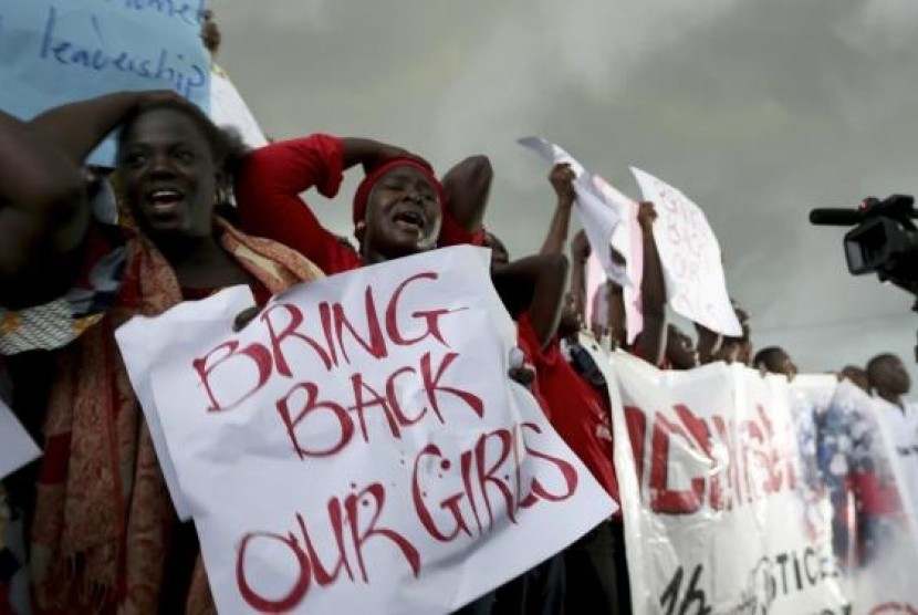 Women react during a protest demanding security forces search harder for 200 schoolgirls abducted by Boko Haram two weeks ago in Abuja April 30, 2014.