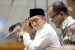 Menteri Agama Lukman Hakim Saifuddin bersiap mengikuti rapat kerja dengan Komisi VIII DPR di Kompleks Parlemen, Senayan, Jakarta, Kamis (25/7).