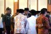 Silaturahim dengn BKPRMI. Presiden Joko Widodo (tengah) saat tiba di acara Silaturahim dengan Badan Koordinasi Pemuda Remaja Masjid Indonesia (BKPRMI) di Jakarta, Rabu (25/4).