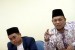 Imbas Pengesahan RUU PIHU. Ketua Komisi Pengawasan Haji Indonesia (KPHI) Samidin Nashir (kanan) menyampaikan paparan di kantor KPHI, Jakarta, Jumat (5/4/2019).
