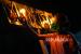 Seorang anak menyalakan lampu minyak yang diletakkan di alikusu (arkus) saat tradisi tumbilotohe atau malam pasang lampu di halaman rumahnya di Bulota, Kabupaten Gorontalo, Gorontalo, Rabu (20/5/2020). Tradisi tumbilotohe untuk menyambut hari raya Idul Fitri tahun ini dilakukan secara sederhana di rumah masing-masing tanpa ada perayaan festival akibat pandemi COVID-19