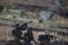Tentara Israel menembakkan gas air mata selama bentrokan dengan warga Palestina di pos pemeriksaan Hawara, selatan kota Nablus, Tepi Barat, Selasa, 18 Mei 2021.