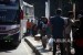 Pemudik berjalan seusai turun dari bus di Terminal Kampung Rambutan, Jakarta, Senin (18/6).