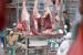Pedagang daging sapi memajang daging sapi di pasar.