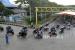 Sejumlah pemudik sepeda motor berjalan menuju kapal penyebrangan di Pelabuhan Bakauheni, Lampung Selatan, Lampung, Ahad (8/5/2022). Penumpang di Pelabuhan Bakauheni Melonjak 84,9 Persen