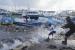 Seorang nelayan melihat kapal-kapal yang rusak akibat Badai Beryl di Bridgetown, Barbados, Senin (1/7/2024). Perubahan iklim membuat banyak negara dilanda cuaca ekstrem.