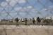  Tentara Israel berjaga di dekat bagian pagar pemisah Israel yang rusak, yang digunakan oleh pekerja Palestina untuk menyeberang ke Israel, di desa Jalameh, Tepi Barat. Otoritas Palestina (PA) yang berada di Ramallah, Tepi Barat hingga saat ini masih berjuang untuk membayar gaji para pegawai negeri.