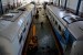 Pekerja melakukan perawatan sistem rem dan sistem pendingin ruangan pada gerbong kereta api kelas ekonomi, di Depo Kereta Poncol Semarang, Jateng, Senin (6/7). (Antara/R. Rekotomo)