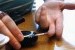 A woman tests her blood sugar level as part of her management of diabetes. 