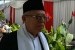 Calon Wakil Presiden Ma'ruf Amin didampingi istri halal bi halal dengan Presiden Joko Widodo dan Iriana Widodo di Istana Negara, Jakarta, Rabu (5/6).