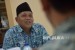 Ketua Komisi Pengawas Haji Indonesia Samidi Nashir bersama sejumlah jajaran komisioner KPHI saat melakukan kunjungan di kantor Republika, Jakarta, Kamis (7/4).