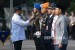 Menteri Perhubungan Budi Karya Sumadi (kiri) menyematkan pin kepada anggota TNI saat apel gelar pasukan Angkutan Lebaran 2019 di Stasiun Gambir, Jakarta Pusat, Ahad (26/5/2019).