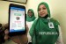 Petugas Badan Penyelenggara Jaminan Sosial (BPJS) menunjukkan Aplikasi Mudik BPJS Kesehatan di Lhokseumawe, Aceh, Senin (4/6).