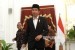  Presiden Joko Widodo usai memberikan keterangan pers terkait kuota jamaah haji di Istana Merdeka, Jakarta, Rabu (11/1). 