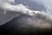 Puncak gunung api Karangetang terpantau dari laut bagian barat Pulau Siau, Kabupaten Kepulauan Sitaro, Sulawesi Utara.