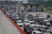 Sejumlah kendaraan pemudik memadati ruas gerbang tol Cipali-Palimanan, Cirebon, Jawa Barat, Kamis (22/6).