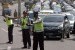 Tiga Polisi mengatur lalu lintas menuju kawasan wisata Puncak di Gadog, Ciawi, Bogor, Jabar.