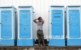 A Rohingya refugee stands next to portable toilets at a temporary shelter in Sabang, Aceh province, Indonesia, 19 December 2023. More than 150 Rohingya people, mostly women and children, are accommodated by the local government amid residents