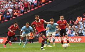 Bruno Fernandes (C) of Manchester United converts a penalty to score the 1-1 equaliser goal during the FA Cup final soccer match between Manchester City and Manchester United, in London, Britain, 03 June 2023.  