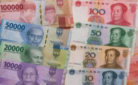 Ilustrasi uang rupiah dan Renminbi