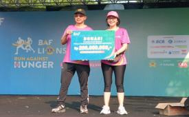 Chairman Yayasan Lions Indonesia Willy Suwandi Dharma dan  Presiden Direktur BAF Lynn Ramli