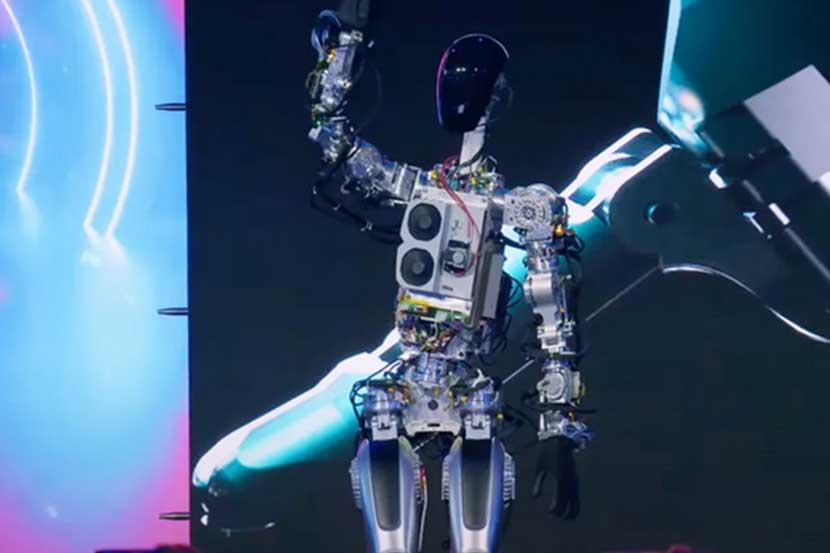 Prototipe pertama Optimus, nama sandi untuk Tesla Bot, melambaikan tangannya di acara Tesla AI Day 2022 event.