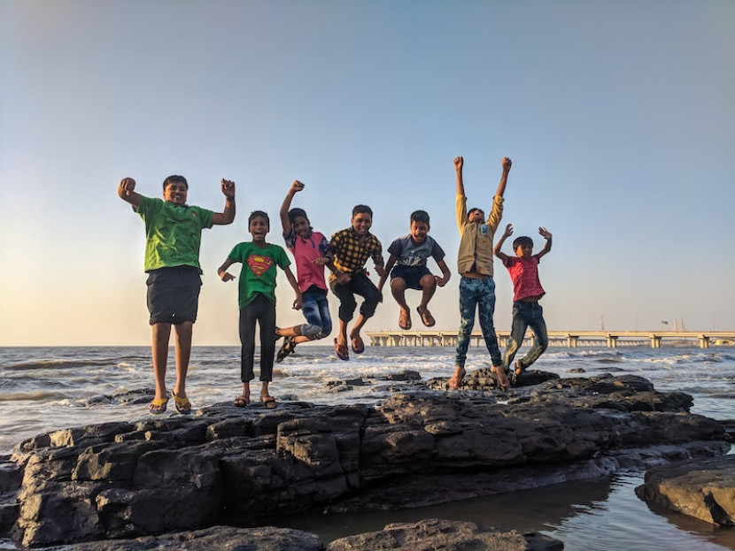 Photo by Guduru Ajay bhargav: https://www.pexels.com/photo/boy-wearing-green-crew-neck-shirt-jumping-from-black-stone-on-seashore-939702/