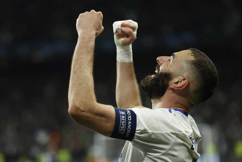 Striker Real Madrid Karim Benzema merayakan gol ke gawang PSG pada laga Liga Champions, Kamis (10/3/2022) dini hari WIB.