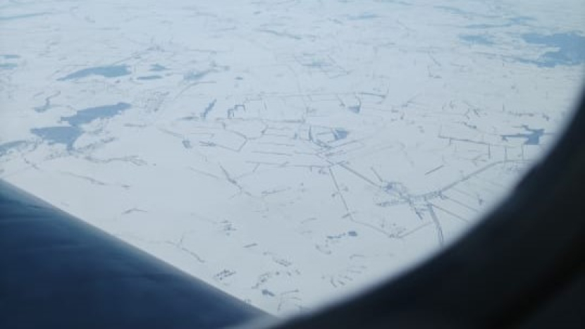Moskow memutih terlihat dari jendela pesawat militer yang kami tumpangi, Kamis (14/3/2024).  (Dok. Yeyen Rostiyani)