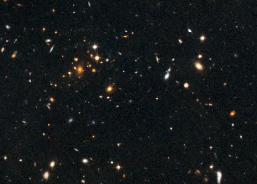 Sebuah gambar yang diambil oleh Teleskop Luar Angkasa Hubble NASA, menunjukkan sekelompok galaksi yang berada 10 miliar tahun cahaya jauhnya. Gambar: NASA/ESA/University of Florida, Gainsville/University of Missouri-Kansas City/UC Davis