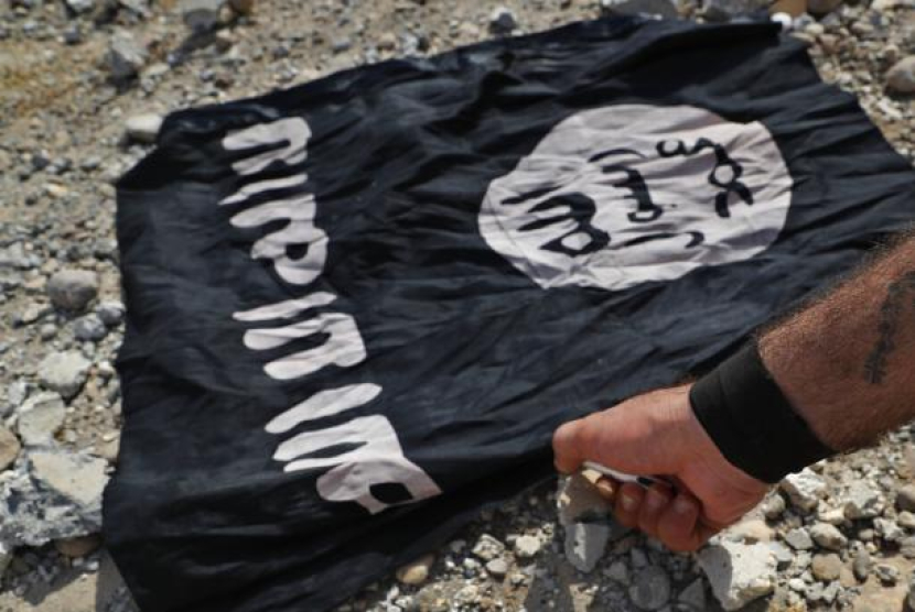 Bendera ISIS (ilustrasi) (AP Photo/Hussein Malla)