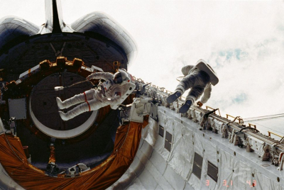 “The First Spacewalk: Astronauts Perform Historic Mission on Maiden Voyage of Space Shuttle Challenger”